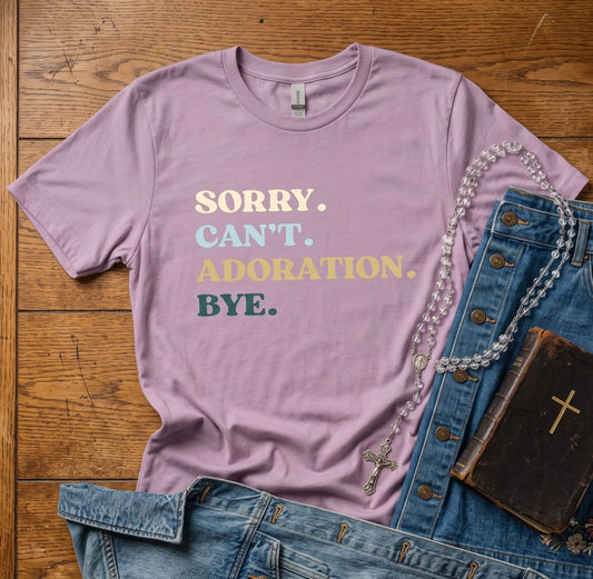 A lavender graphic t-shirt with the text 'SORRY. CAN'T.
