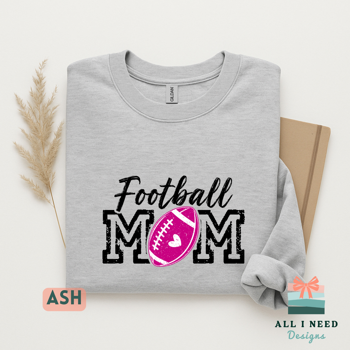 Proud Football Mom Hoodie for Game Day, pink heart design, unisex sizing, sizes XS-3XL