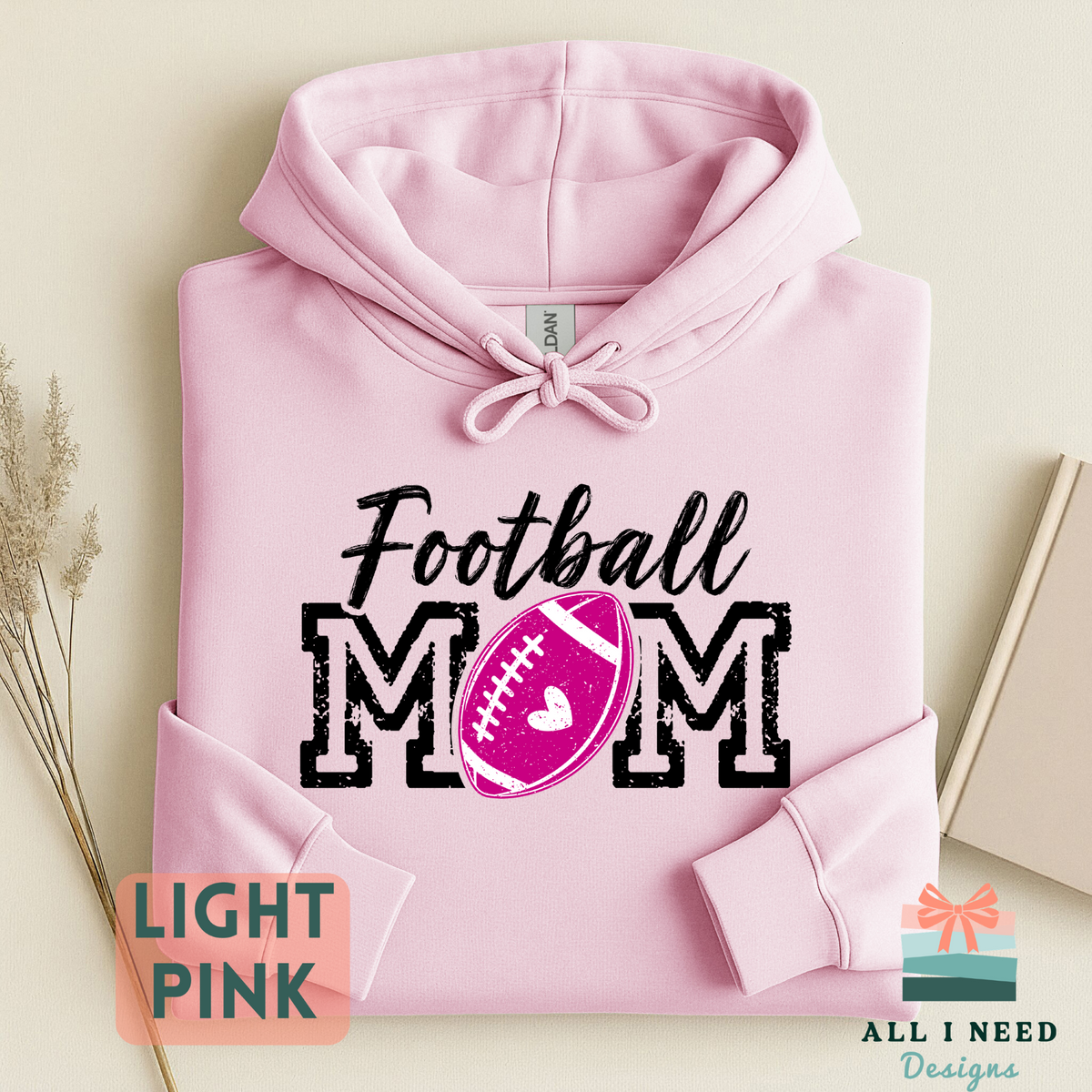 Proud Football Mom Hoodie for Game Day, pink heart design, unisex sizing, sizes XS-3XL