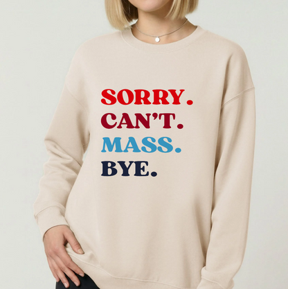 A woman wearing a cream-colored crewneck sweatshirt with the text 'SORRY. CAN'T.
