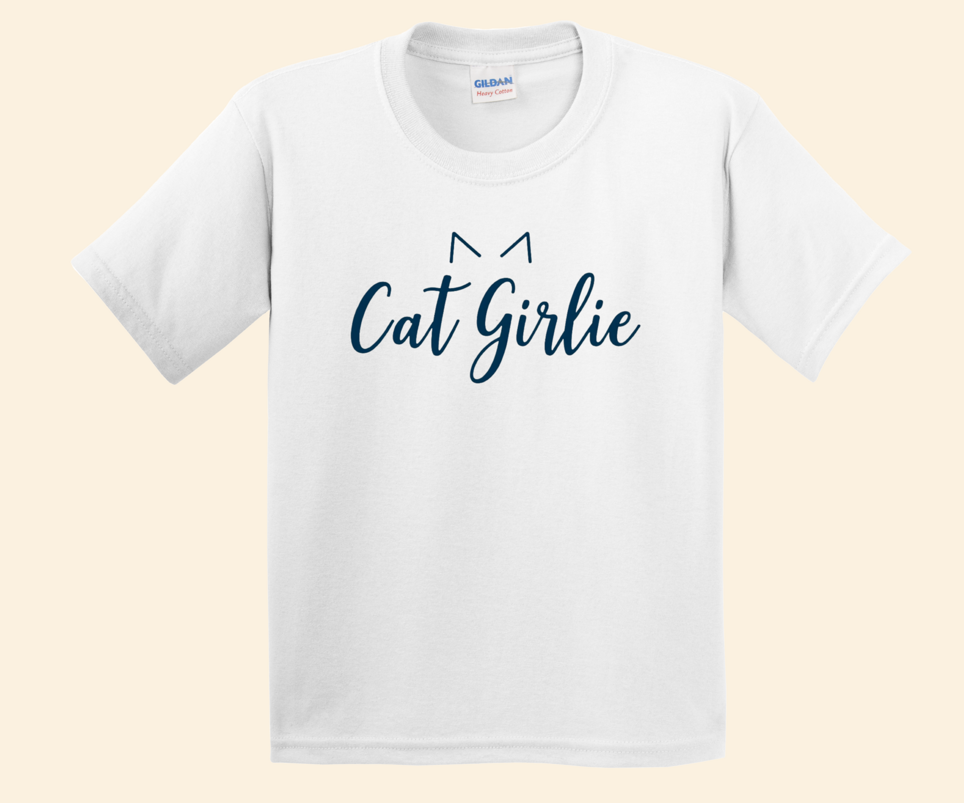 A white short-sleeve crewneck t-shirt featuring the text 'Cat Girlie' in dark blue script, with a simple cat ear graphic above the letters, displayed on a light beige background.