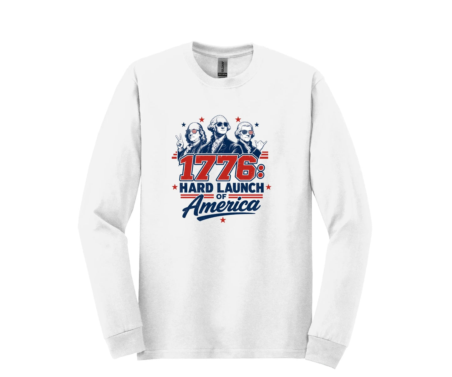 All I Need Designs white long-sleeve tee with "1776: Hard Launch of America" graphic featuring founding fathers in sunglasses.