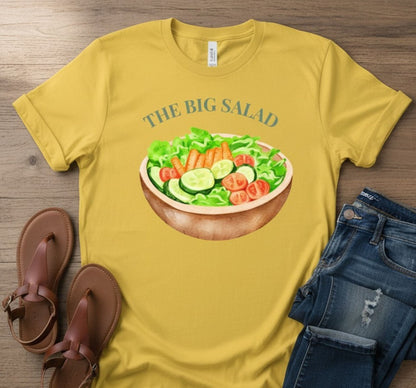 All I Need Designs yellow cotton blend unisex tee with "The Big Salad" graphic and a watercolor bowl of salad.