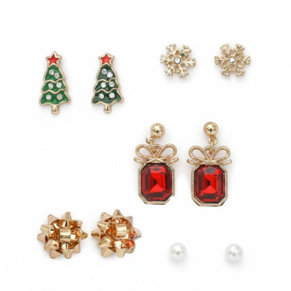 All I Need Designs 5-pair holiday earring set featuring Christmas trees, snowflakes, red gemstone presents, gold bows, and pearl studs.