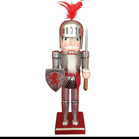 All I Need Designs 14" wooden knight nutcracker in silver armor with red plume, shield, and sword.