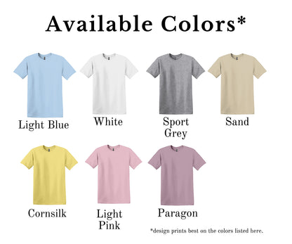 All I Need Designs St. Luke’s Fine Arts Studio T-Shirt with gold cross and laurel wreath design. Available in light blue, white, sport grey, sand, cornsilk, light pink, and paragon.