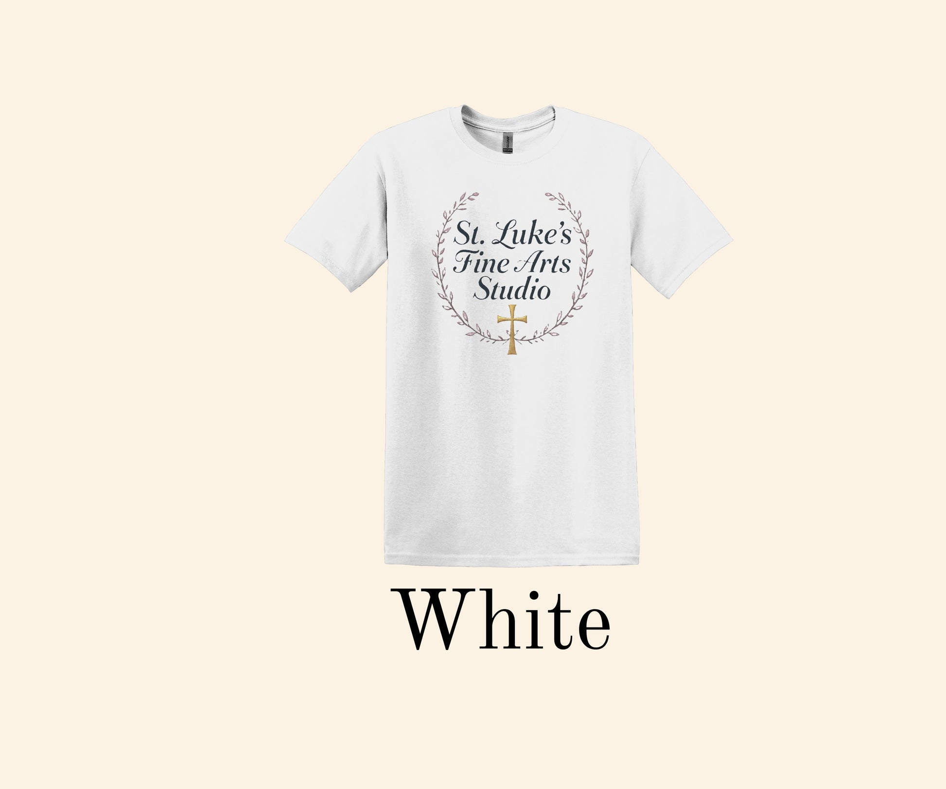 All I Need Designs white cotton blend t-shirt with St. Luke’s Fine Arts Studio text and gold cross within a laurel wreath.