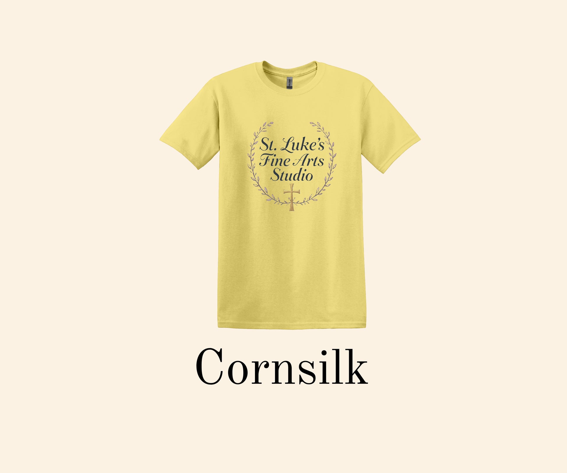 All I Need Designs Cornsilk yellow cotton blend t-shirt with St. Luke's Fine Arts Studio and gold cross design.